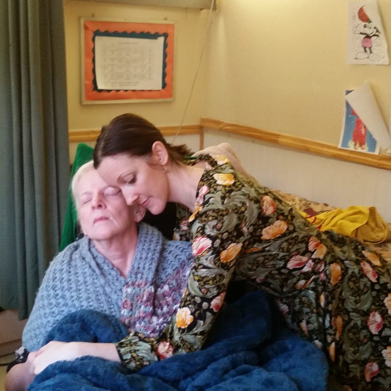 Daughter hugging her elderly mother